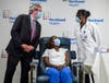 Northwell Health President and CEO Michael Dowling joined nurse Sandra Lindsay as she received her second shot from Dr. Michelle Chester.