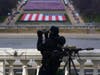 A law enforcement personnel monitors the area during the 59th Presidential Inauguration at the U.S. Capitol in Washington, Wednesday, Jan. 20, 2021. 