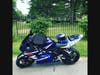 The helmet and jacket of Nicole Vargas rest on her motorcycle at her funeral.