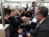 Michael van der Veen, an attorney for former President Donald Trump, fist bumps a colleague as they depart on the Senate Subway, on Capitol Hill after the Senate acquitted Trump in his second impeachment trial in the Senate at the U.S. Capitol.
