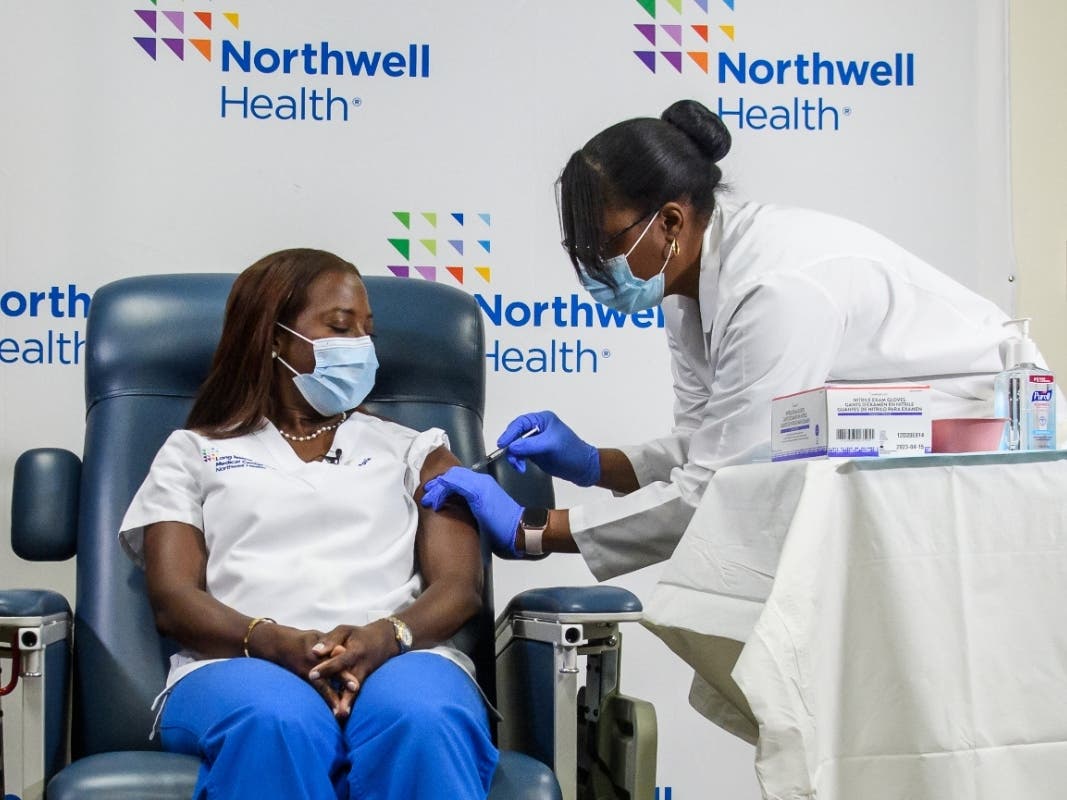 Long Island Jewish Hospital Medical Center nurse Sandra Lindsay was the first person in the United States to receive the COVID-19 vaccine. She is seen here getting her second dose of the vaccine from Dr. Michelle Chester in January.