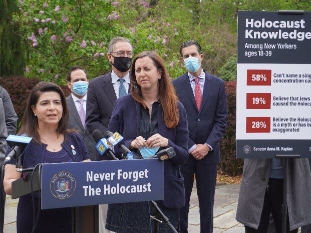 State Sen. Anna M. Kaplan, sponsor of the bill, Michael Cohen, eastern director of the Simon Wiesenthal Center, Sen. Jim Gaughran, Assemb. Nily Rozic, Arnie Herz, president of the American Jewish Committee on Long Island, at a news conference Thursday.
