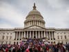 A large group of pro-Trump protesters stand on the East steps of the Capitol Building after storming its grounds on Jan. 6, 2021, in Washington, DC.