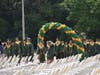 “Pomp and Circumstance” was played as the students walked through the green and gold balloon arches for the commencement exercises.
