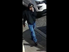 The suspect was wearing a dark-colored hoodie pulled up over his head.