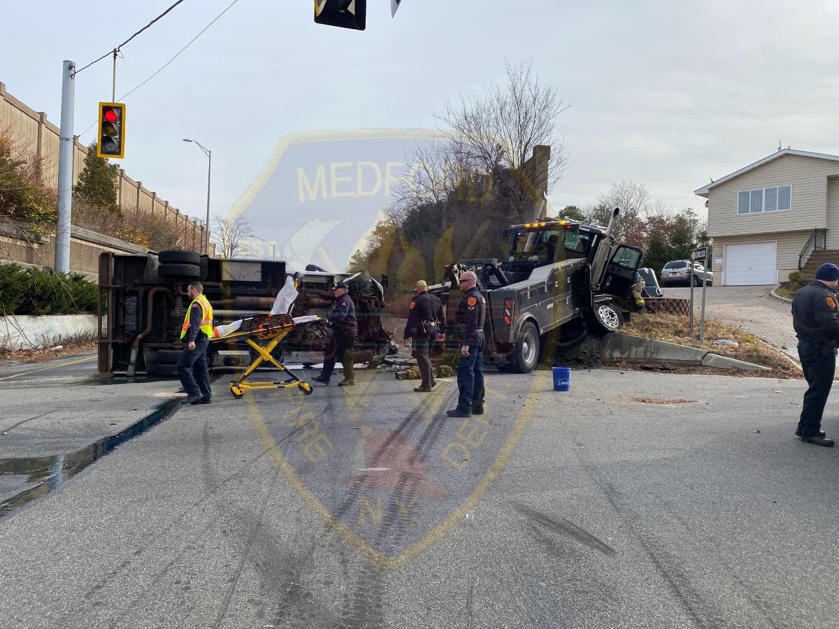 Diesel fuel spilled out onto the Long Island Expressway's South Service Road in Medford Tuesday after two trucks crashed.