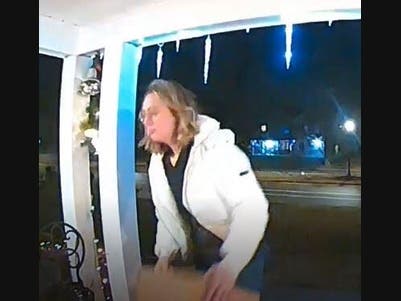 Suffolk police said this woman was caught on camera removing packages from a porch on Stony Brook.