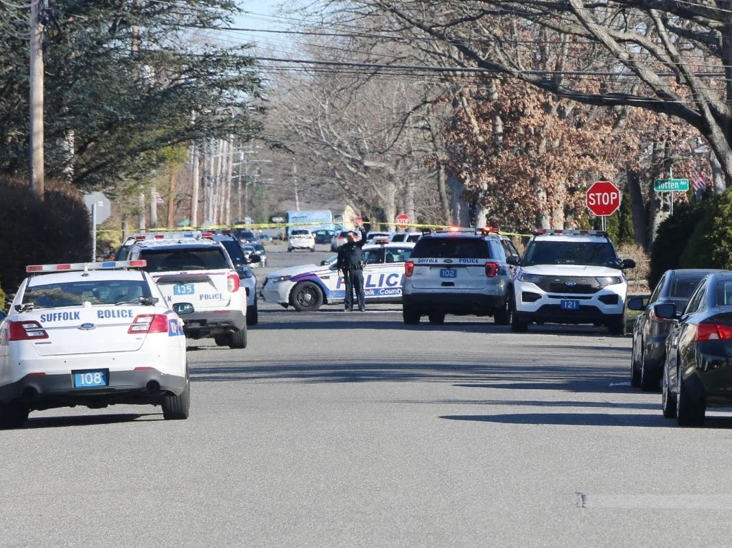 An 85-year-old woman was shot to death by her son's ex-girlfriend on Thursday, Suffolk police said.