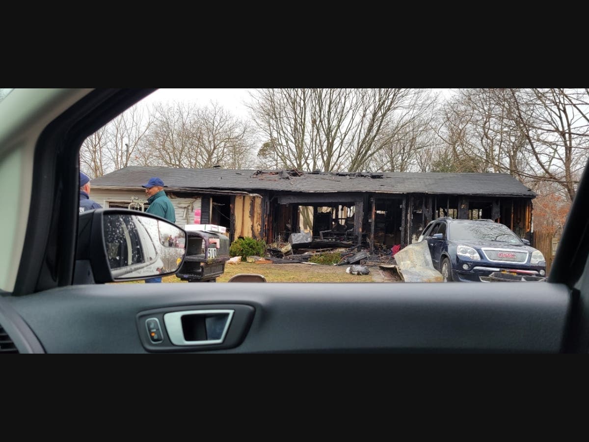 An early morning fire damaged an East Patchogue home and a vehicle on the property on New Year's Eve, Suffolk police said.
