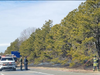 Area firefighters were called to a brush fire that broke out in a wooded area on Sunrise Highway in North Bellport on Saturday morning.