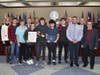 Technology class students James Prendergast, Gavin Donovan, Gianna Imeidopf, Thomas Anzalone, Brendon Artzt, Jacob Bazata and teacher John Schumacher with the Town Board.