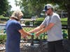 Kevin Kelly’s daughter, Taylor Anderson, and her husband, Mark Anderson, cutting the
ribbon at the garden's opening.