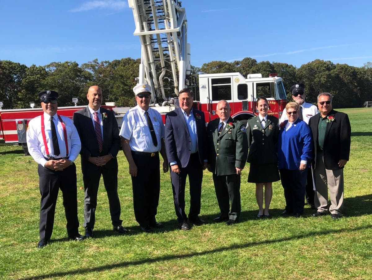 Bellport area community leaders honored the late John Conquest of the South Country School District by dedicating the middle school's athletic complex in his honor. 