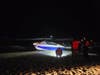 The U.S. Coast Guard is searching for the owner of an unmanned boat that was found washed up at Smith Point County Park in Shirley on Sunday night.