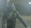 In a surveillance image released by police, a suspect can be seen wearing a puffy jacket and a face covering.
