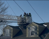 Officers Ryan McNulty and Sean Roche joined him until firefighters from the Mastic Beach Fire Department responded with a ladder truck to help the three down to ground level, police said.