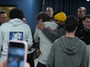 Kervens Lesperance gets a hug at the press conference Wednesday.