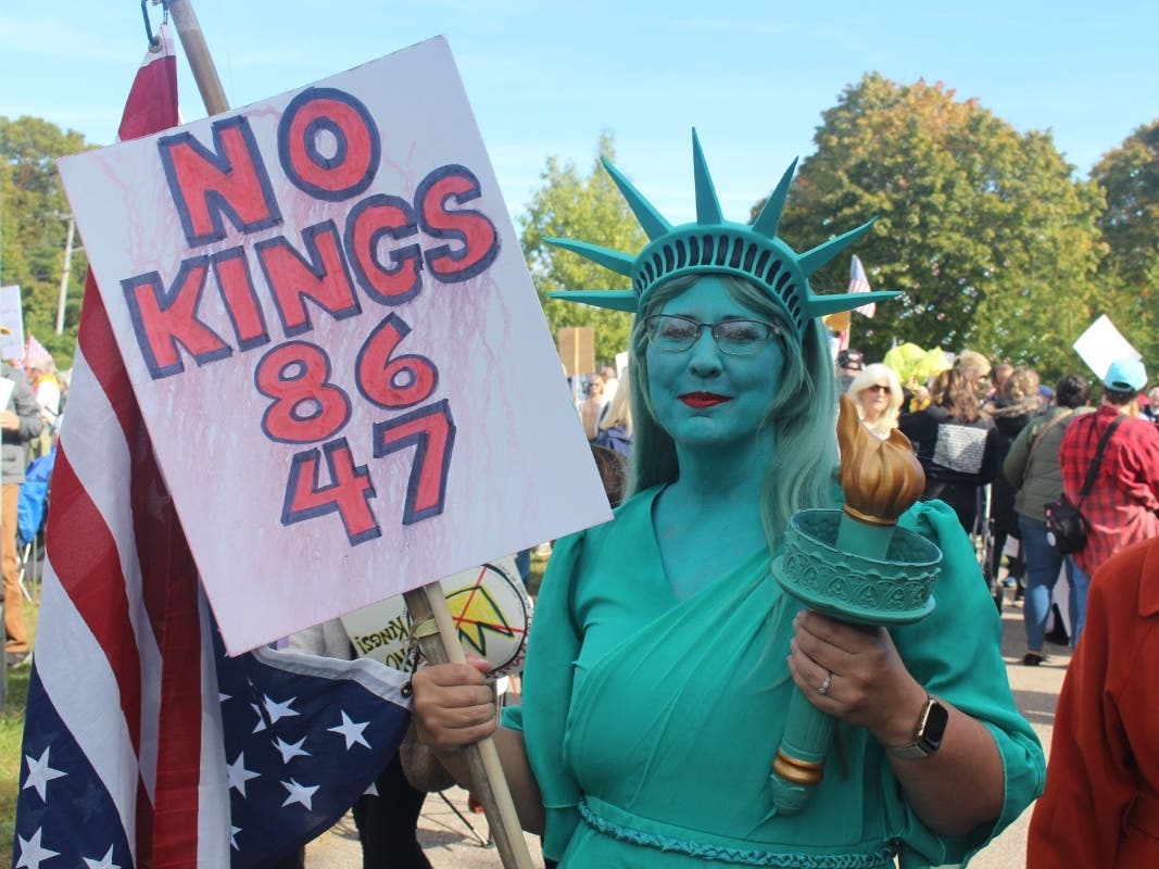 A protester at a 'No Kings' rally in Port Jefferson Station in October 2025.