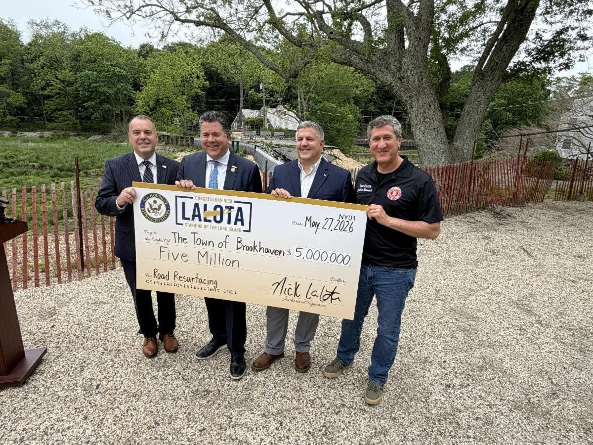 A ceremonial check for $5 million was presented last week to Brookhaven officials to support the resurfacing of deteriorating roadways, which includes $2.5 million for the full restoration of storm-ravaged Harbor Road in Stony Brook.