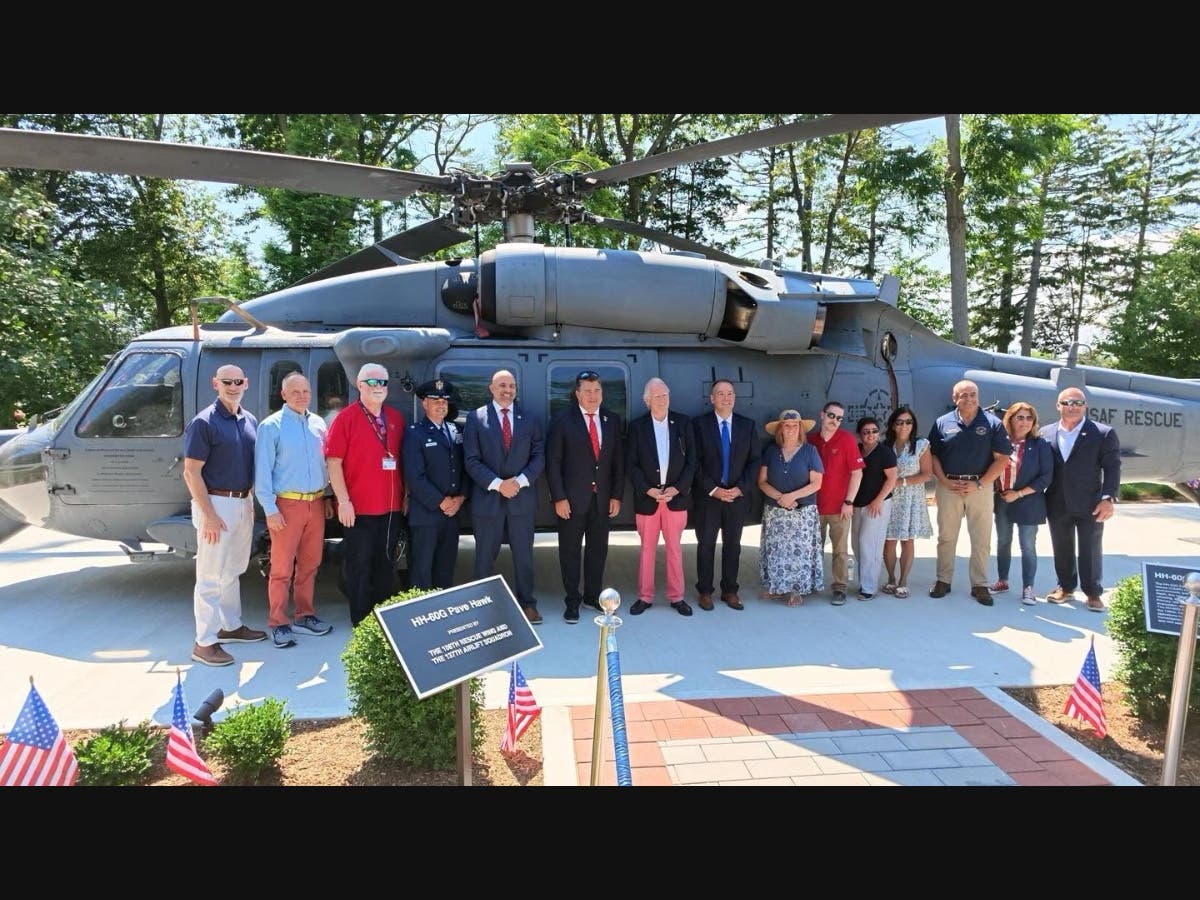 Local officials gathered recently to celebrate the installation of a Black Hawk helicopter at the the Lt. Michael Murphy Navy SEAL Museum in West Sayville.