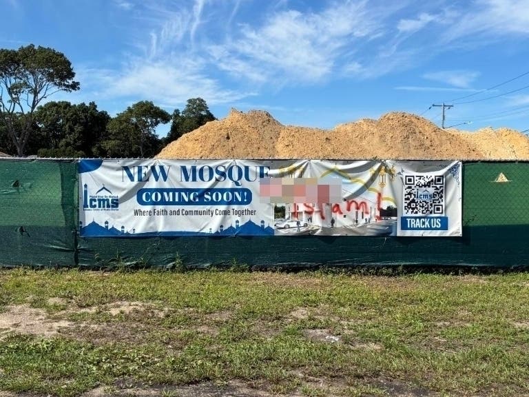 Suffolk police are continuing to investigate an incident in which a sign celebrating a new Islamic center in Shirley was vandalized by hateful graffiti.