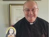 Msgr. Robert Meyer, pastor of St. Teresa of Avila Parish, brought Flat Teresa to work.