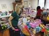 Christine Geiges-Krey, a staff member of the Archdiocese of Newark’s Mercy House, helps select presents for families in need during its annual Christmas Toy Giveaway on December 17, 2021.