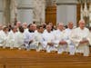 Priests from throughout the Archdiocese of Newark proceed into the Cathedral Basilica of the Sacred Heart for a Chrism Mass on April 15, 2019. 