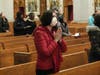 A member of the faithful prays for Pope Emeritus Benedict XVI during Cardinal Joseph W. Tobin’s Memorial Mass for the late pontiff in Newark’s Cathedral Basilica of the Sacred Heart on January 12, 2023.
