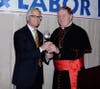 Cardinal Joseph W. Tobin, Archbishop of Newark (right), presents Joseph S. Colalillo with the business honoree award at the Archdiocese of Newark’s 30th Annual Business & Labor Recognition Reception at The Grove in Cedar Grove on March 7, 2023.