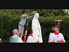 A young parishioner places a flower wreath on a Marian statue during a May Crowning event at St. Bartholomew the Apostle Church in Scotch Plains, which marks its 75th year in 2023.