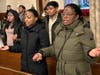 Community members pray after receiving ashes during an Ash Wednesday Mass at St. Patrick’s Pro-Cathedral in Newark on February 14, 2024. 