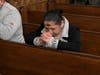 A community member prays after receiving ashes during an Ash Wednesday Mass at St. Patrick’s Pro-Cathedral in Newark on February 14, 2024.