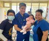 From left to right: Dr. Maria Kwok, Dr. Patrick Perin, and interpreter Noemi Pena tend to a baby in La Puerta, Honduras, during Our Lady of Mount Carmel Church’s medical mission trip. 