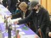 Visitors press personal objects against relics, thereby transforming them into third-class relics suitable for personal prayer at home, during a sacred relics exhibit at Our Lady of Mount Carmel Oratory in Montclair on February 24, 2024. 