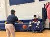 Seton Hall Prep and Academy360 students practiced passing a basketball.