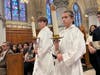 Dominic Auricchio and his older brother, Vincenzo, participate in the Archdiocese of Newark's Jubilee Mass for Catholic Schools as altar servers at Newark's Cathedral Basilica of the Sacred Heart in 2025.