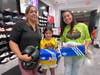 Kids from the Student & Athlete Mentoring Program enjoyed back to school shopping at The Mall at Wellington Green