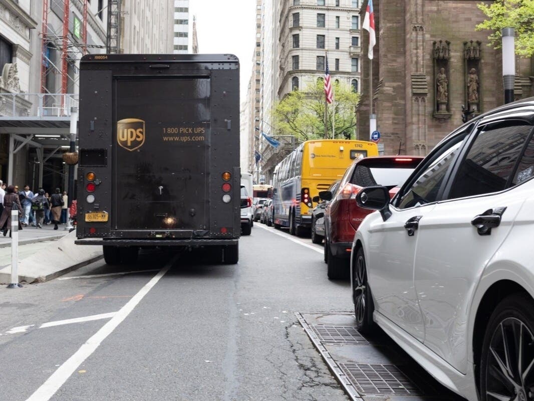 A UPS trucks blocks Broadway in Lower Manhattan, forcing traffic into the bus lane, April 28, 2026.