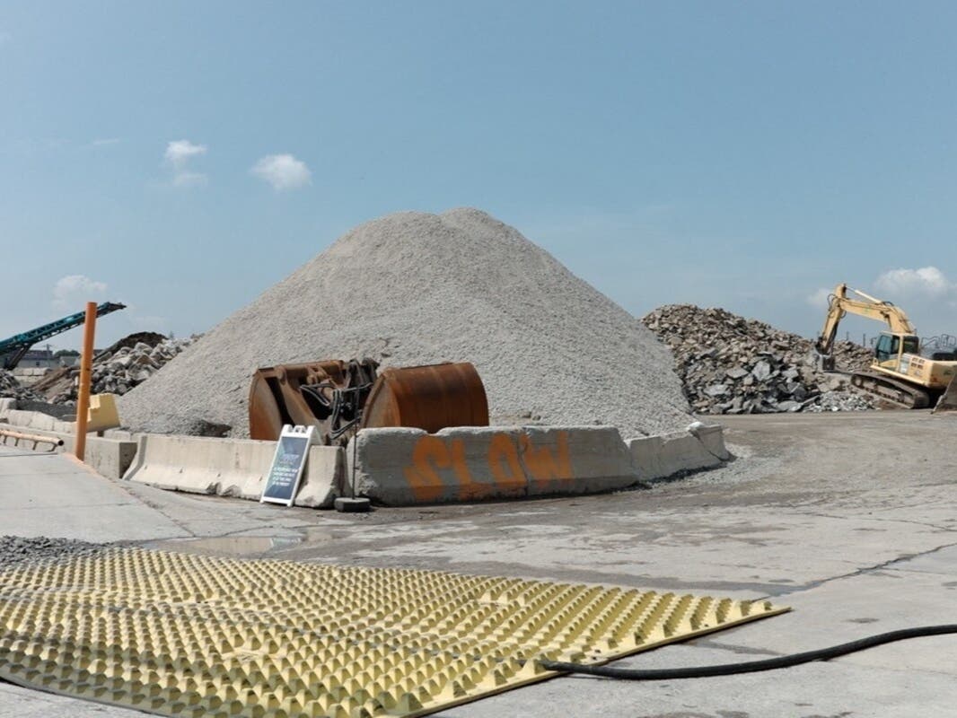 A concrete recycling plant sits across the street from the Redfern Houses in Far Rockaway, Aug. 19, 2026.