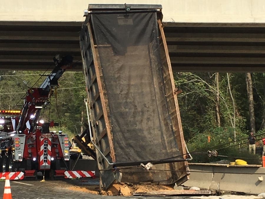 A dump truck got stuck on an overpass near mile marker 134 on I-95 northbound on Tuesday afternoon, blocking traffic for hours. Authorities said the driver accidentally raised the bed, causing it to wedge itself into the overpass.