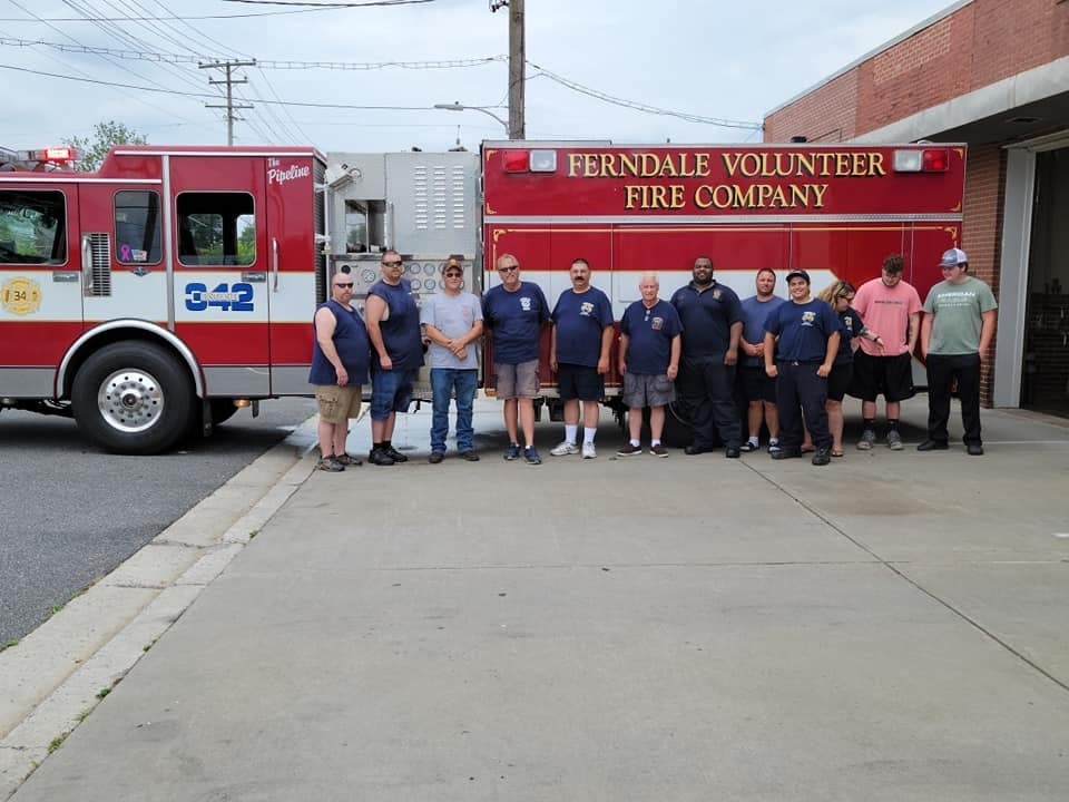 Members of the Ferndale Volunteer Fire Company (FVFC) and the Chestnut Ridge Volunteer Fire Department pose in front of Engine 342. The FVFC donated the engine to the Sneedville, Tennessee-based Chestnut Ridge department.