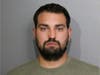 Keegan G. Casteel, 32, of Ankeny, Iowa, was charged with two felony counts of aggravated unlawful use of a weapon after prosecutors said a semi-automatic rifle, handgun and ammunition were found in his Chicago hotel room. 