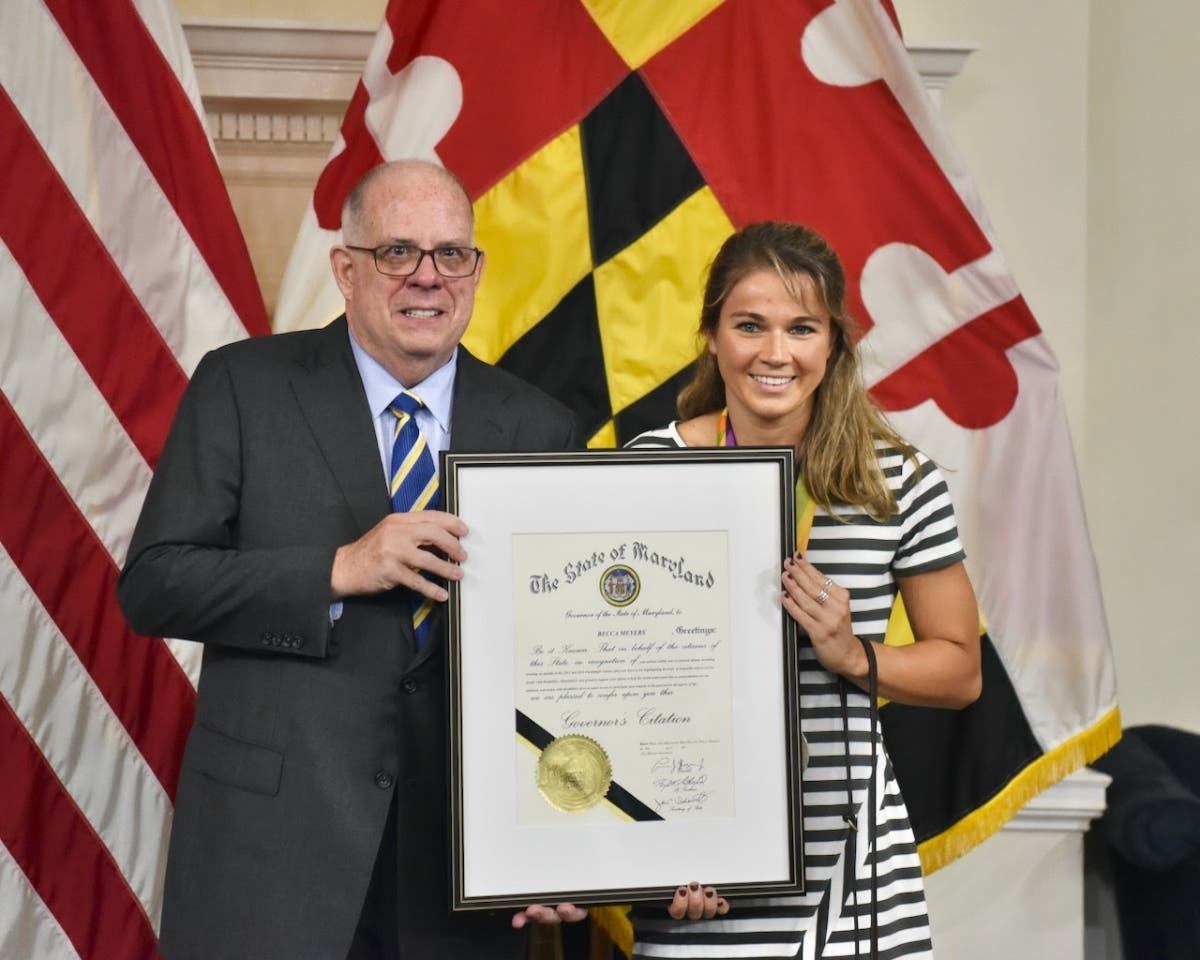 Gov. Larry Hogan presenting a Governor's Citation to celebrated Paralympic swimmer Becca Meyers, who has been forced to withdraw from this summer's Paralympics because her mother, who is her personal care assistant (PCA), is not allowed to attend.  