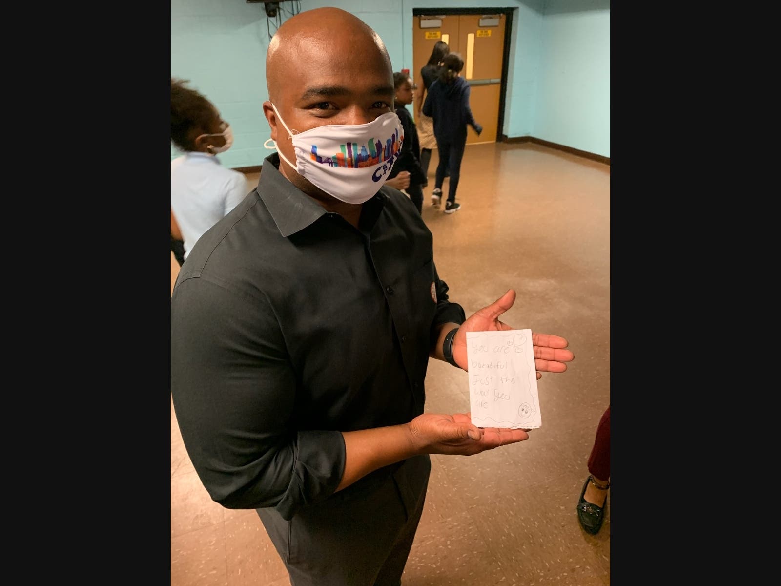Jersey City Ward F Councilman Jermaine Robinson holds up the handwritten note he received from a fifth grader after Robinson told a story about being bullied while in elementary school. 