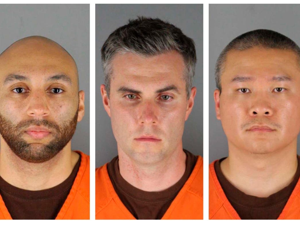 Former Minneapolis police officers (from left) J. Alexander Kueng, Thomas Lane and Tou Thao. They are on trial in federal court accused of violating George Floyd's civil rights as fellow officer Derek Chauvin killed him. 