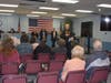 Falls Township Police Chief Nelson Whitney talks to families on Friday following the memorial marker placements. 