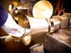 Polishing of a handbell at Malmark, Inc. 