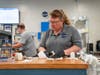 Ed and Kristin Cunningham, owners of The Spot Hometown Deli, make sandwiches at their Elizabethtown eatery. The couple won third place in SCORE's 60th Anniversary Pitch Competition.