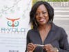 Actress Viola Davis holds a R-YOLO yoga mat.